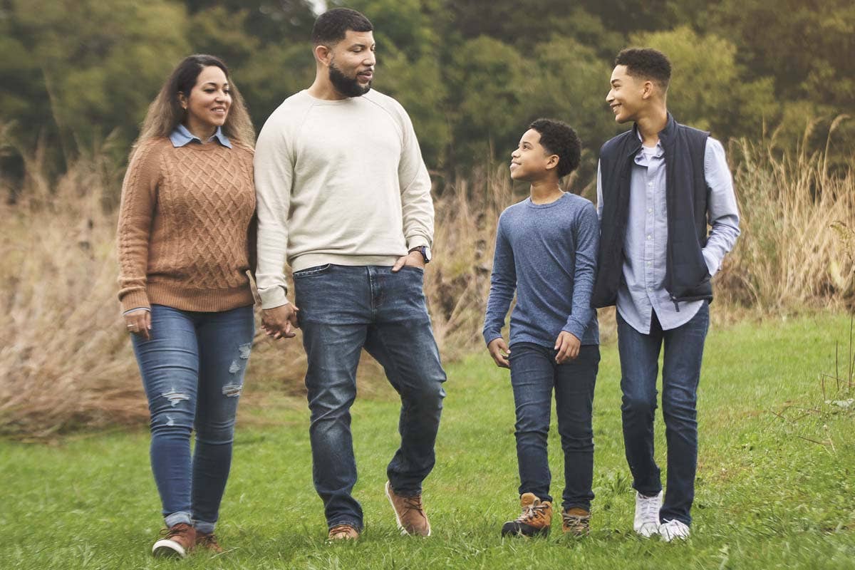 Family on a nature walk in a field